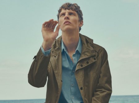Front and center in a lightweight parka, Tim Schuhmacher takes in a breezy summer day with Massimo Dutti.