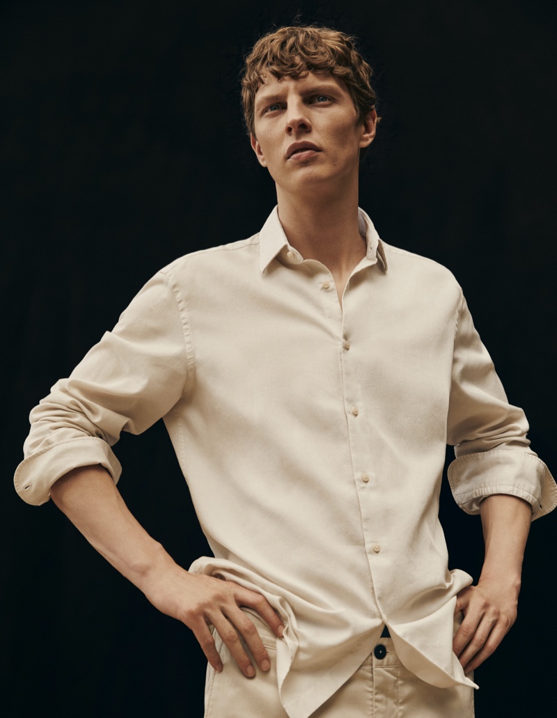 Embracing a neutral color scheme, Tim Schuhmacher wears Massimo Dutti.