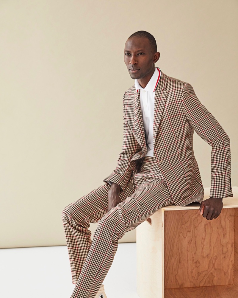 Making a case for dapper suiting, Armando Cabral models a gingham print suit with a white polo shirt from Todd Snyder.