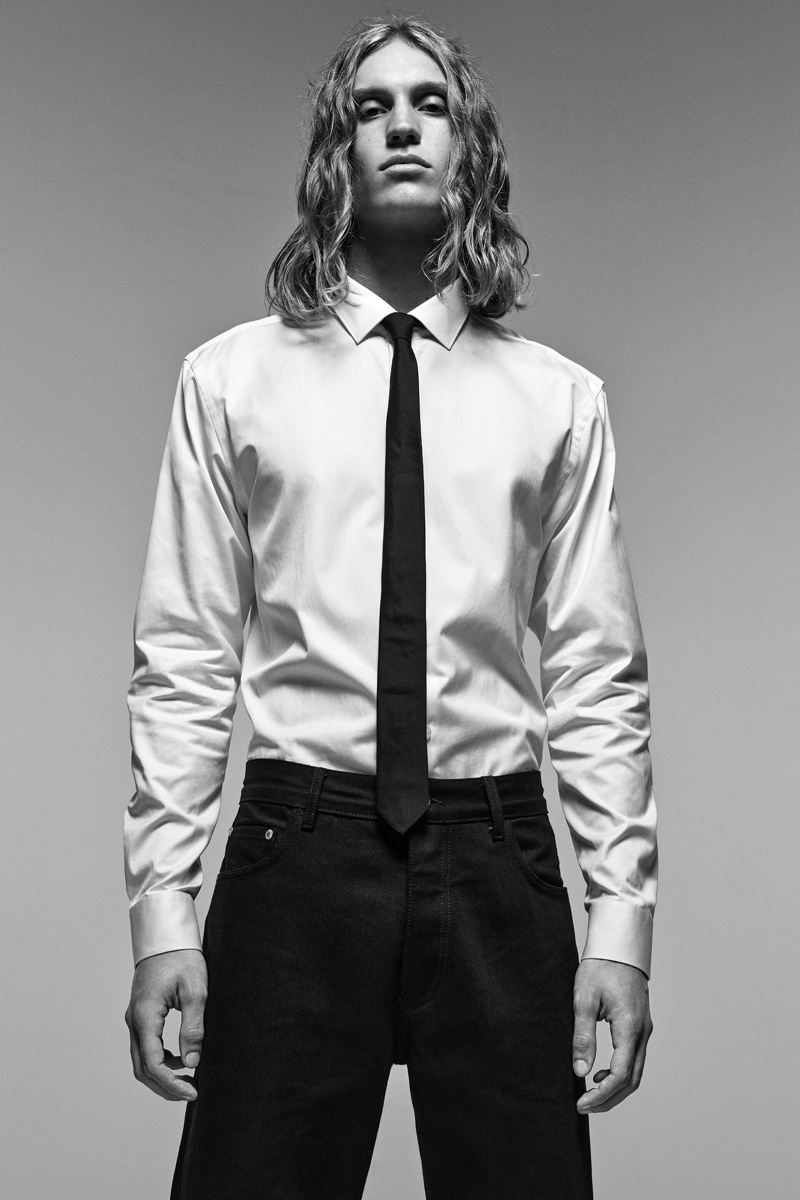 Front and center, Caleb Altice dons a dress shirt and tie with Zara's straight fit jeans.