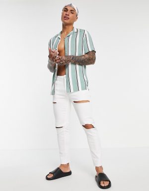 ASOS DESIGN skinny jeans in white with rips and raw hem ASOS DESIGN skinny jeans in white with rips and raw hem