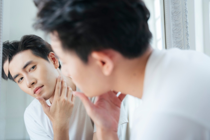 Asian Man Checking Face Mirror