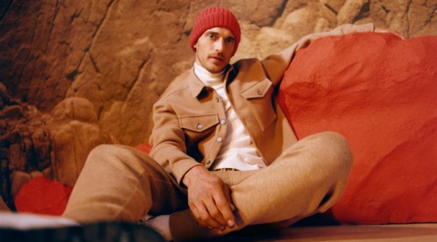 Clément Chabernaud dons a tan colored jacket and joggers with a turtleneck for BOSS's fall-winter 2021 men's campaign.