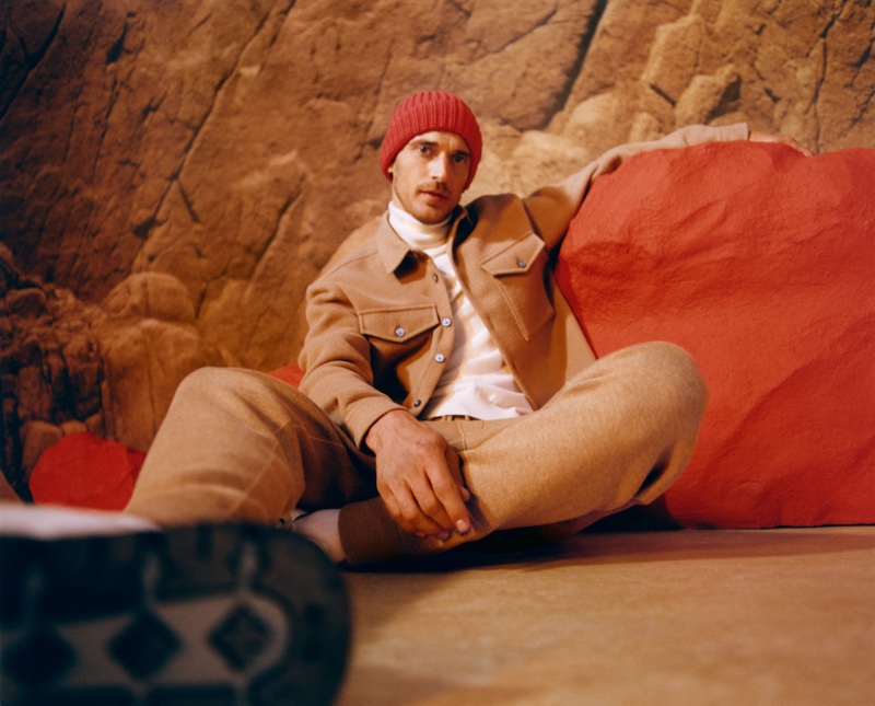 Clément Chabernaud dons a tan colored jacket and joggers with a turtleneck for BOSS's fall-winter 2021 men's campaign.