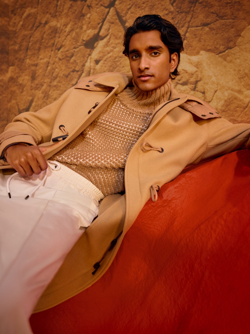 A striking vision in camel, Jeenu Mahadevan sports a dufflecoat for BOSS's fall-winter 2021 men's campaign.