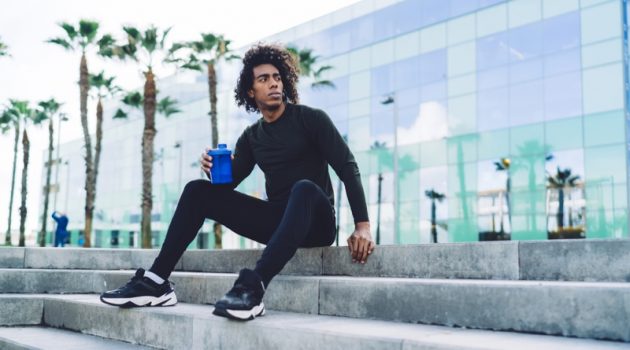 Fitness, Fashion & Functionality Black Man Workout Activewear Look Sitting Steps