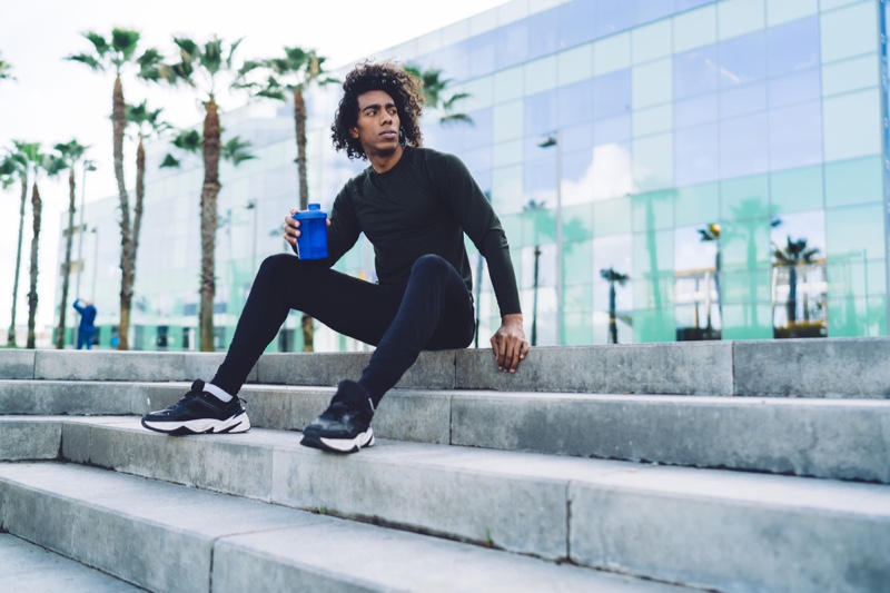 Black Man Workout Activewear Look Sitting Steps