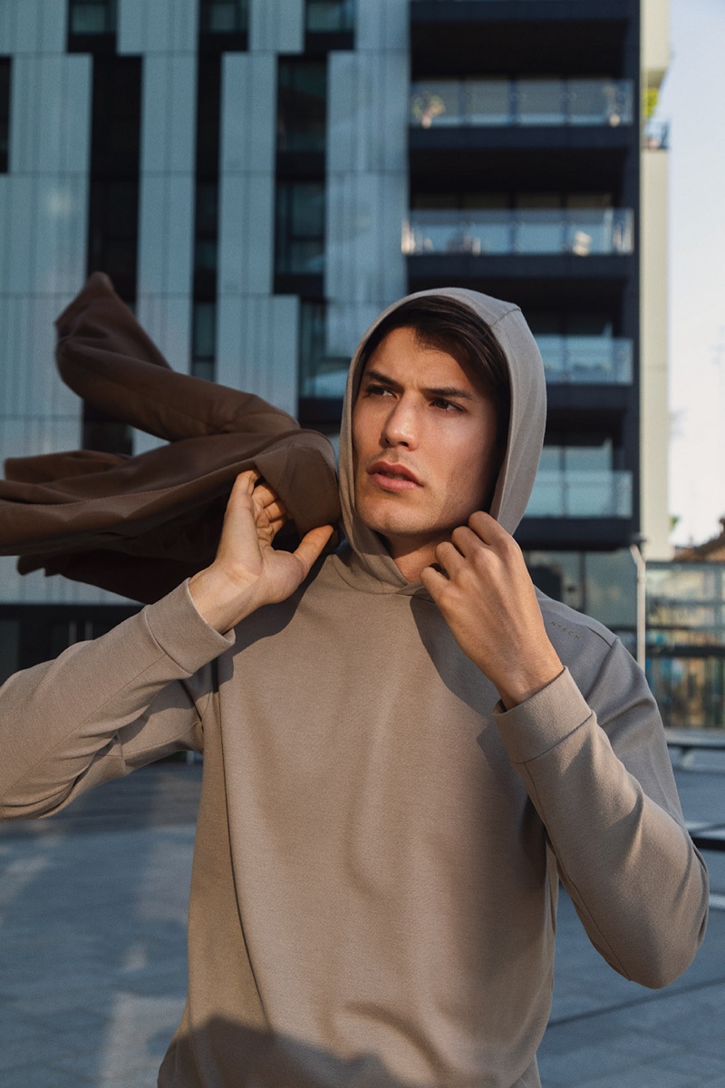 Spanish model Emilio Flores sports a hooded pullover by Boggi Milano.