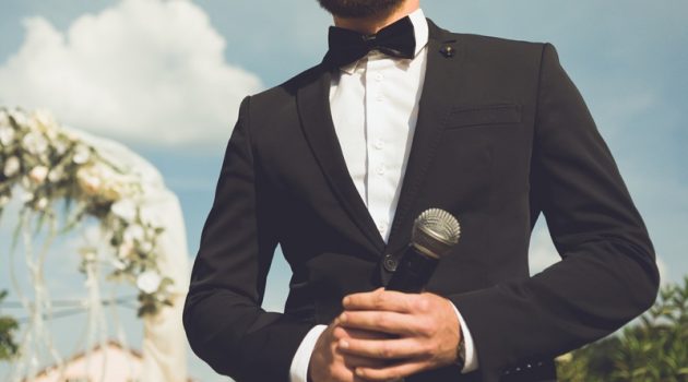 11 Essential Things Every Groom Should Do Cropped Groom Tuxedo Microphone Speech