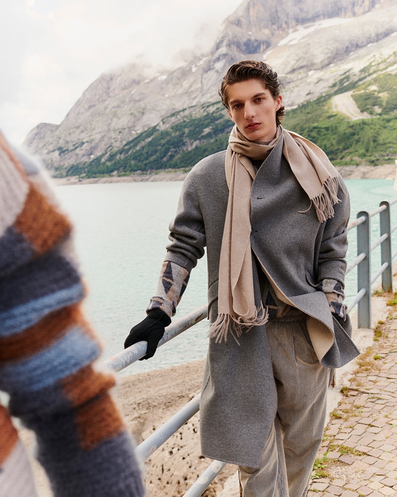 Hugo Gillain is a chic vision as he dons a gray coat and chic layers from Giorgio Armani's fall-winter 2021 men's collection.