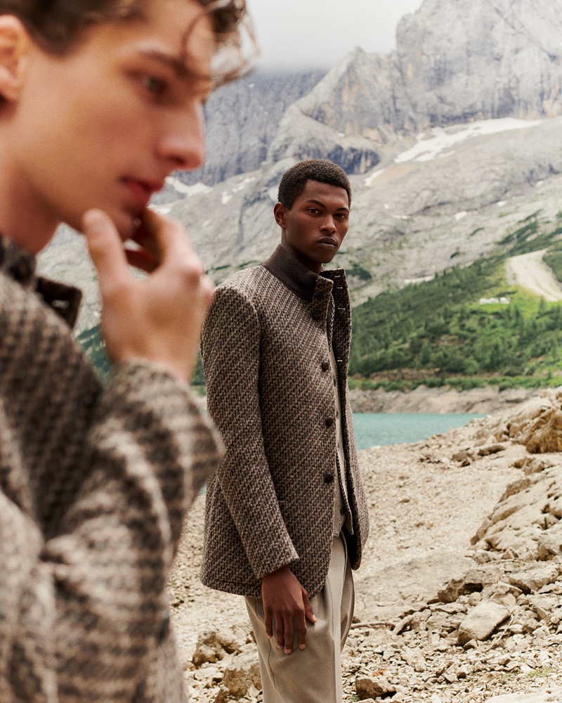 Fabio Tavares dons a tweed jacket with pleated trousers by Giorgio Armani.