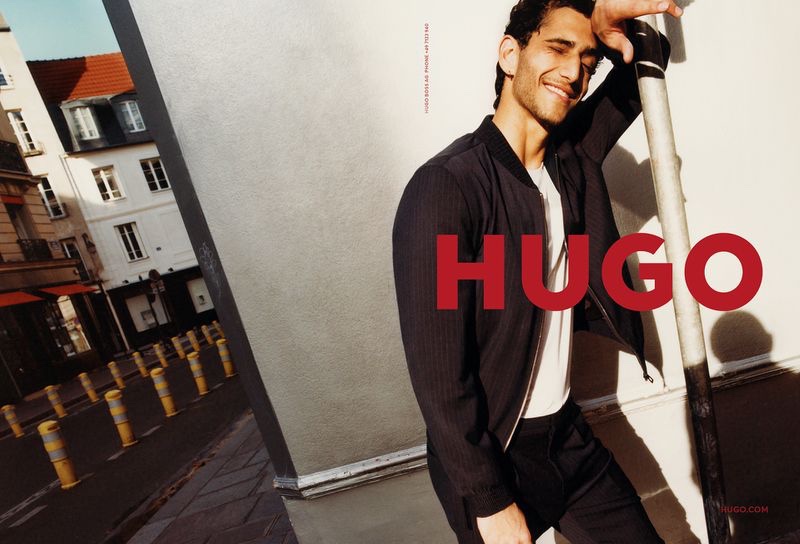 All smiles, Ahmad Kontar fronts HUGO's fall-winter 2021 men's campaign.