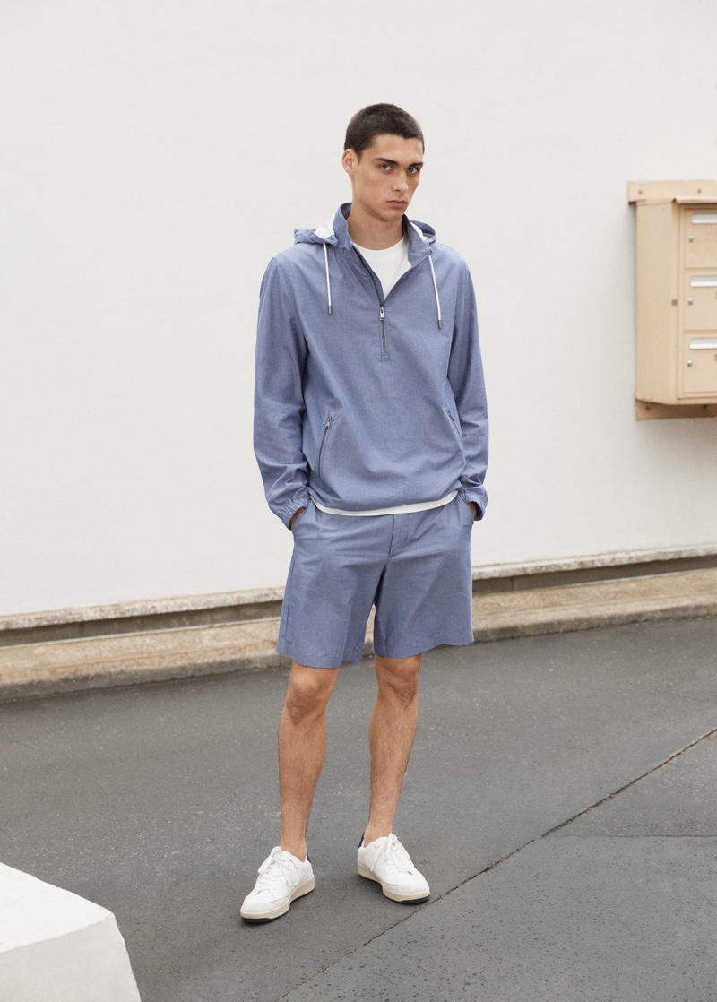 Showcasing CO-ORD style, Ludwig Wilsdorff wears a Mango Man cotton jacket with chino-style Bermuda shorts.