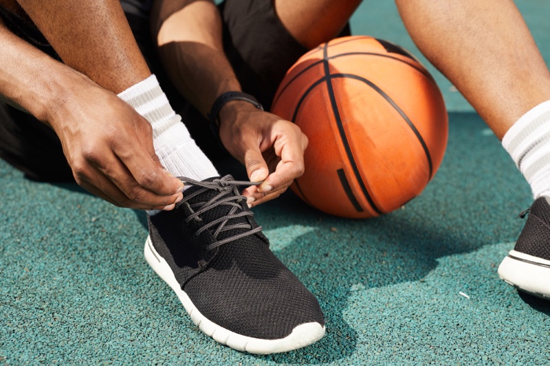 Man Basketball Tying Shoes Socks