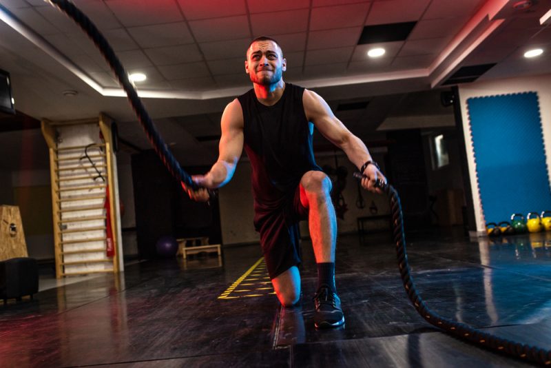 Man Training with Battle Ropes Man Training with Battle Ropes
