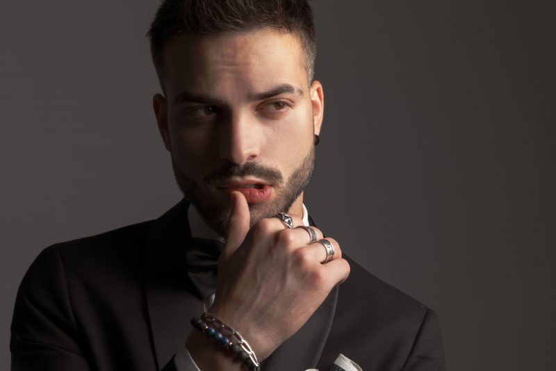 Man Wearing Bracelets and Rings Man Wearing Bracelets and Rings