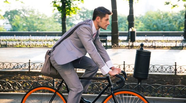 Heading Back to Work? 5 Things to Buy for the Office Man in Suit Riding Bike