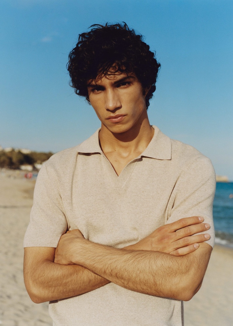 Crossing his arms, Duncan Yair wears a Mango Man fluid linen polo shirt.