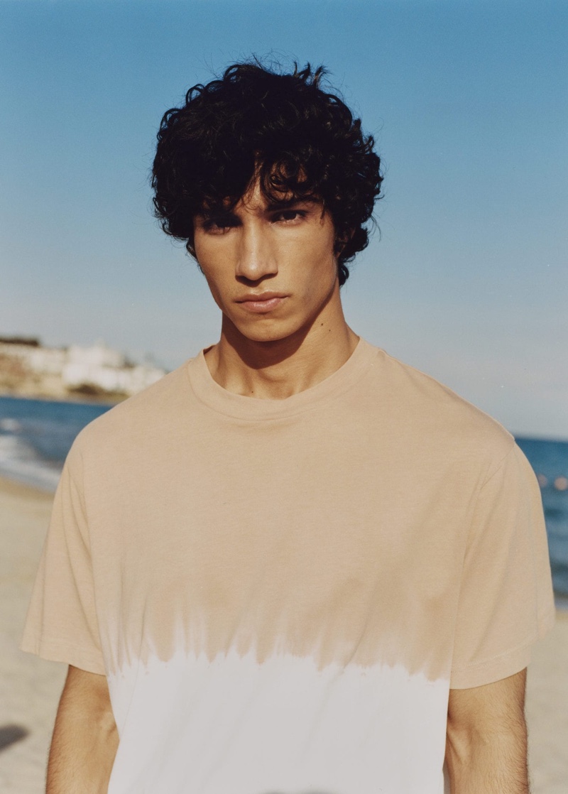 Embracing the latest trends, Duncan Yair rocks a tie-dye relaxed-fit t-shirt from Mango Man.