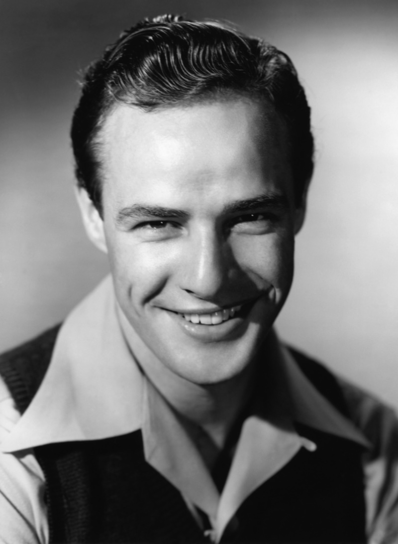 Marlon Brando smiles in a promotional image for Men. 