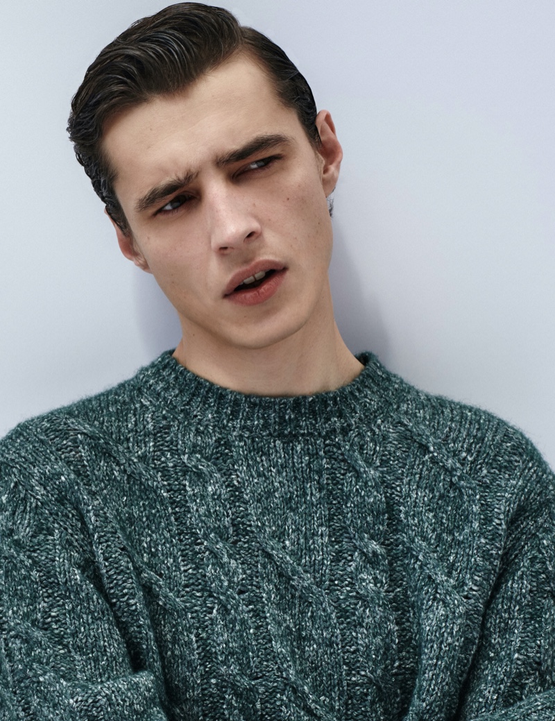 French model Adrien Sahores dons a marle cable-knit sweater from Massimo Dutti.