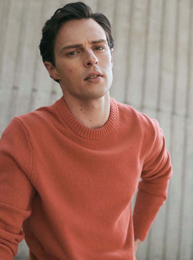 Front and center, Jack Hurrell wears a geranium-colored sweater from Massimo Dutti.