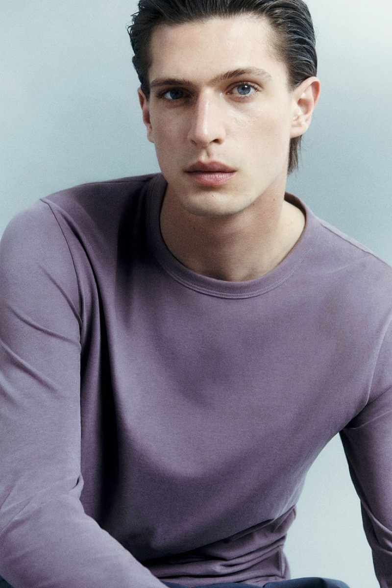 Model Edoardo Sebastianelli dons a regular-fit long-sleeve top from the Pause by COS leisurewear collection.