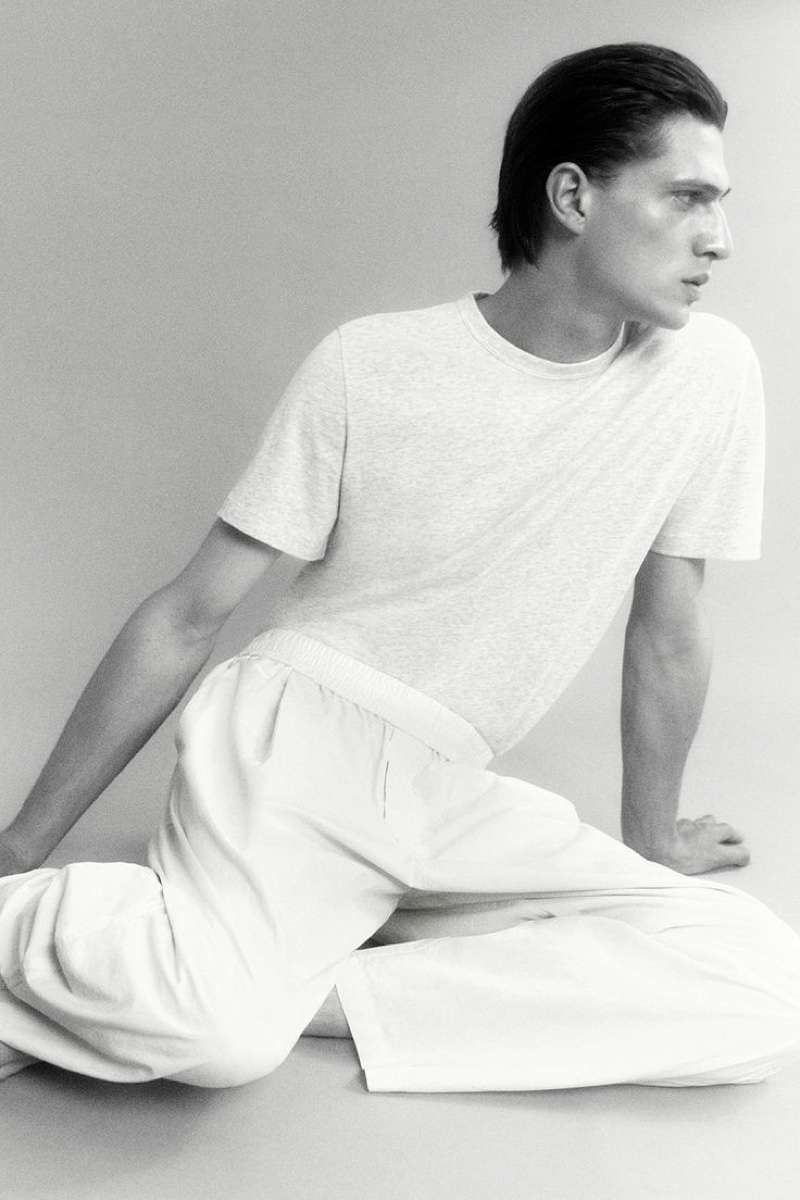 Edoardo Sebastianelli wears a regular-fit brushed cotton t-shirt with oversized-fit wide-leg trousers from the Pause by COS leisurewear collection.