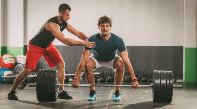 Tips for Choosing the Right Personal Trainer Personal Trainer and Client Weights