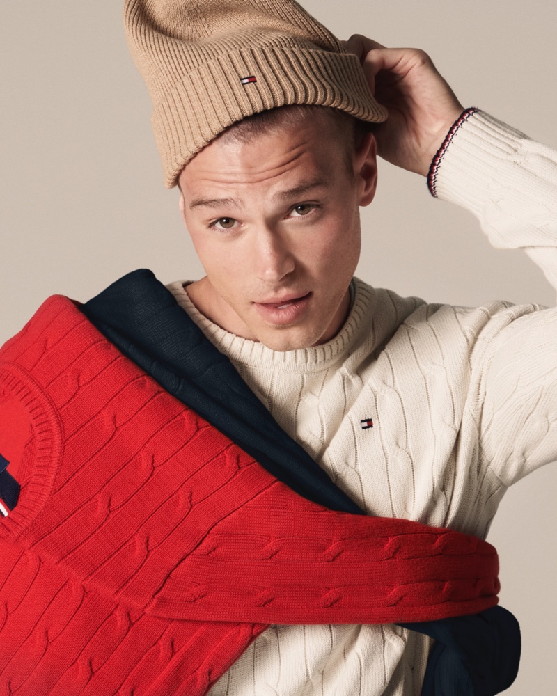 Making a case for cable-knit sweaters, Matthew Noszka stars in Tommy Hilfiger's fall 2021 men's campaign.
