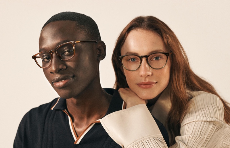 Pictured left, Baba Diop dons Warby Parker's Elias glasses in Cacao Crystal.