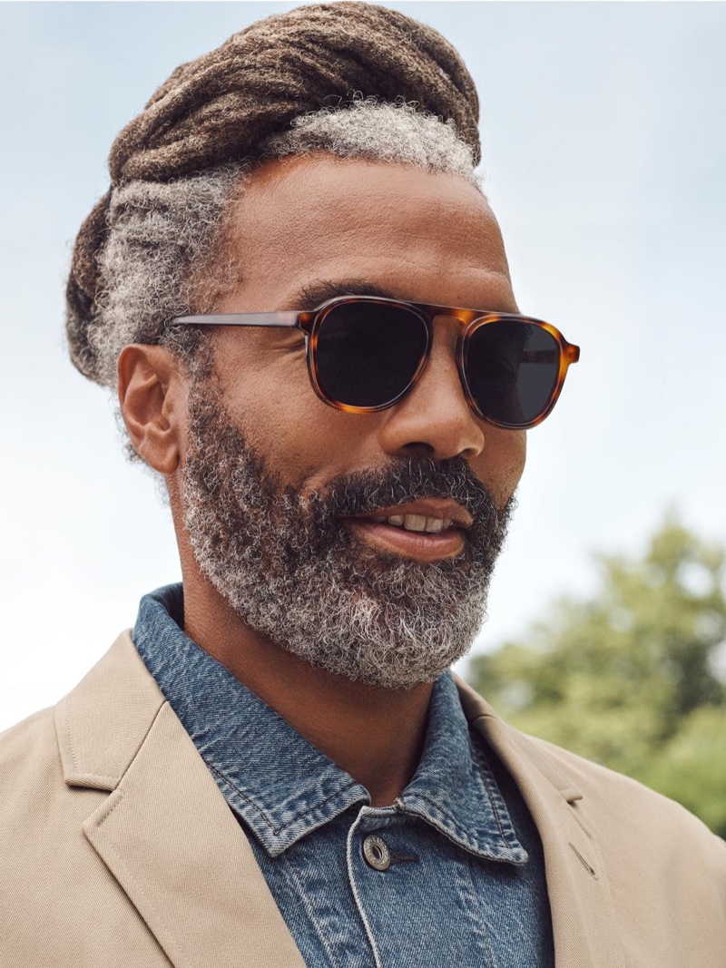 Model Daryl Dismond embraces modern style in Warby Parker's Blaise sunglasses in Woodgrain Tortoise.