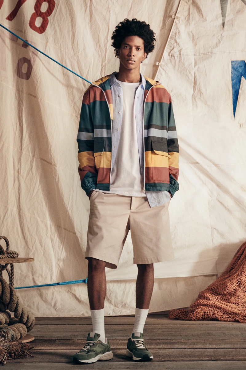 Showcasing casual style, Rafael Mieses wears a hooded striped jacket with shirting and shorts from Zara.