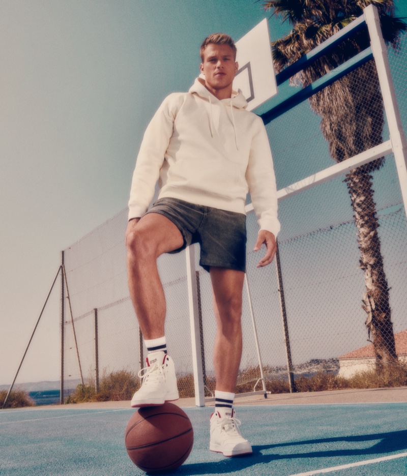 Rocking the brand's white sneakers, Matthew Noszka stars in CCC Sprandi's fall 2021 campaign.