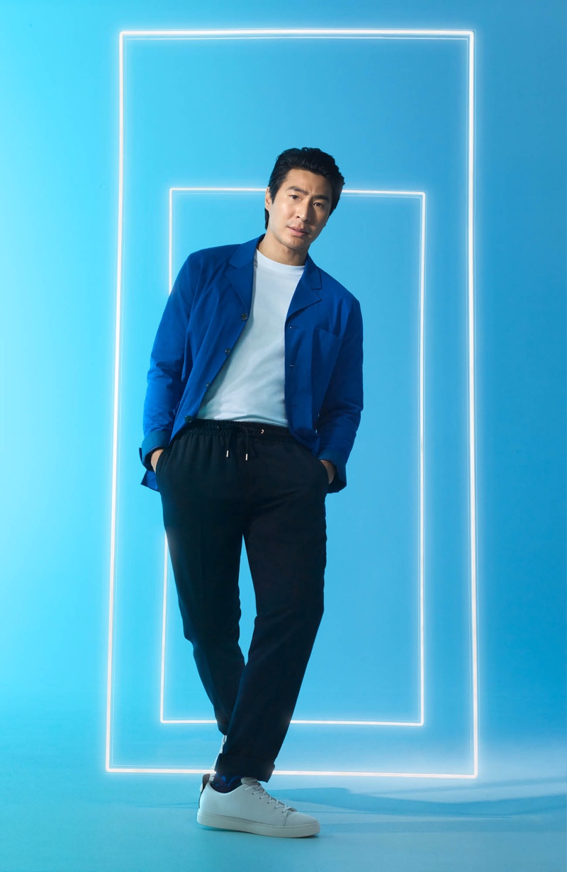 Playing it smart-casual, Chris Pang wears a blue and black leisure look from David Jones.