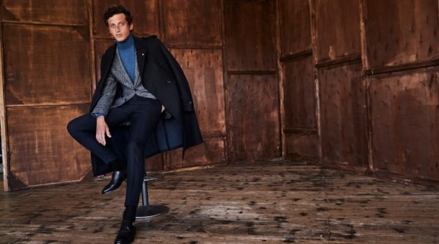 Alexis Inspires in Luigi Bianchi Mantova Fall Collection Donning a coat draped over his shoulders, Alexis Maçon-Dauxerre also models a check suit jacket and turtleneck from Luigi Bianchi Mantova.