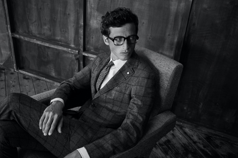 Model Alexis Maçon-Dauxerre sports a windowpane print suit from Luigi Bianchi Mantova's fall-winter 2021 collection.