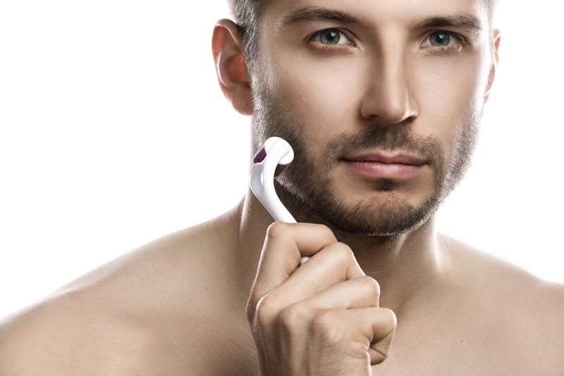 Male Model Using Derma Roller Skincare