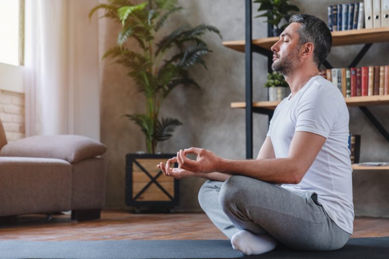 Man Meditating at Home
