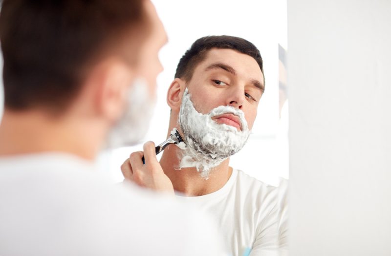 Man Using Safety Razor