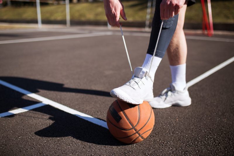 Man Wearing White Basketball Sneakers