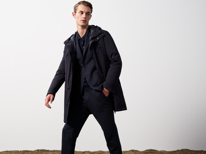 British model Kit Butler wears a parka over a suit from Massimo Dutti's fall 2021 Join Life collection.