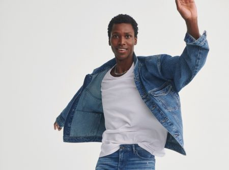 Calvin Royal III doubles down on distressed denim in a jacket and jeans from Mavi's fall-winter 2021 collection.