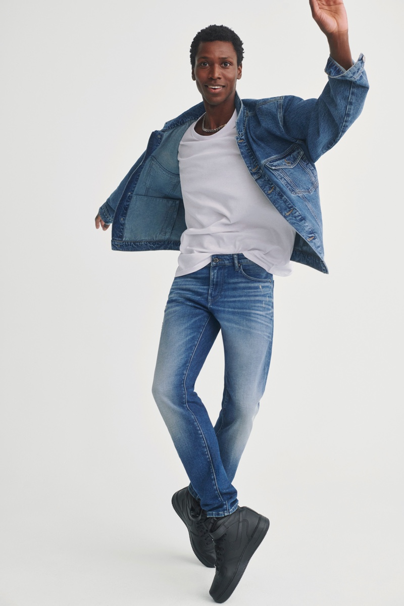 Calvin Royal III doubles down on distressed denim in a jacket and jeans from Mavi's fall-winter 2021 collection.