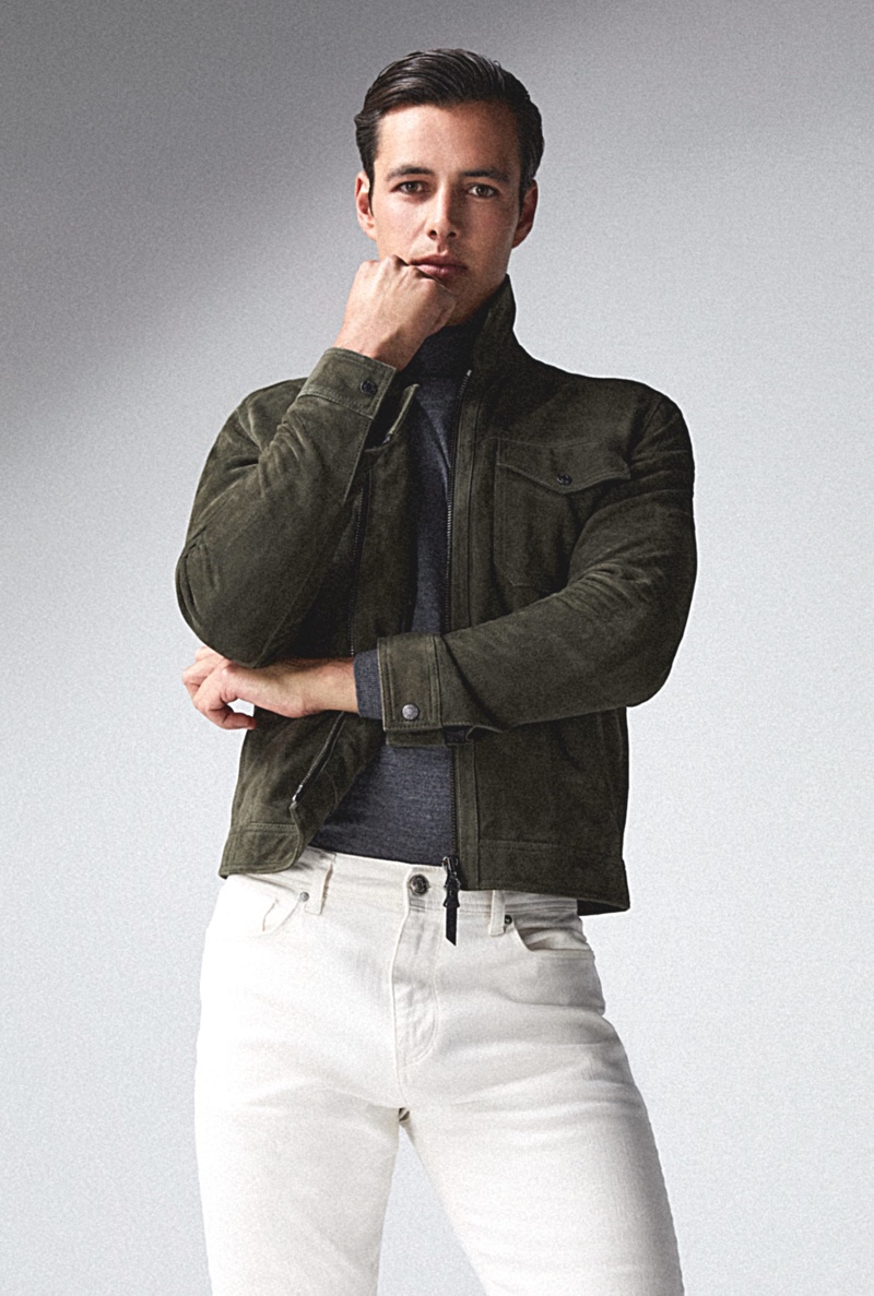 In front and center, Harry Gozzett models a pair of white jeans with Reiss' Pike suede jacket and Caine turtleneck.