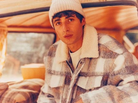 Top model Oscar Kindelan wears a buffalo check jacket from Reserved's fall 2021 Eco-Aware collection.