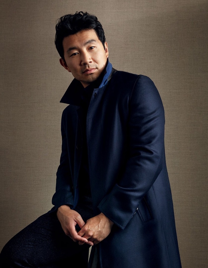 Actor Simu Liu dons a Brioni coat with a cardigan and trousers by Brunello Cucinelli for Esquire Singapore.