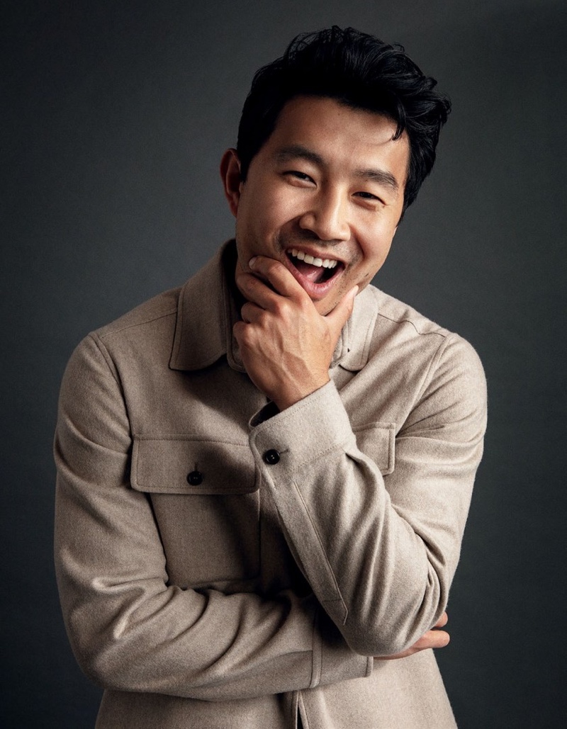 All smiles, Simu Liu wears a Brioni overshirt for Esquire Singapore.