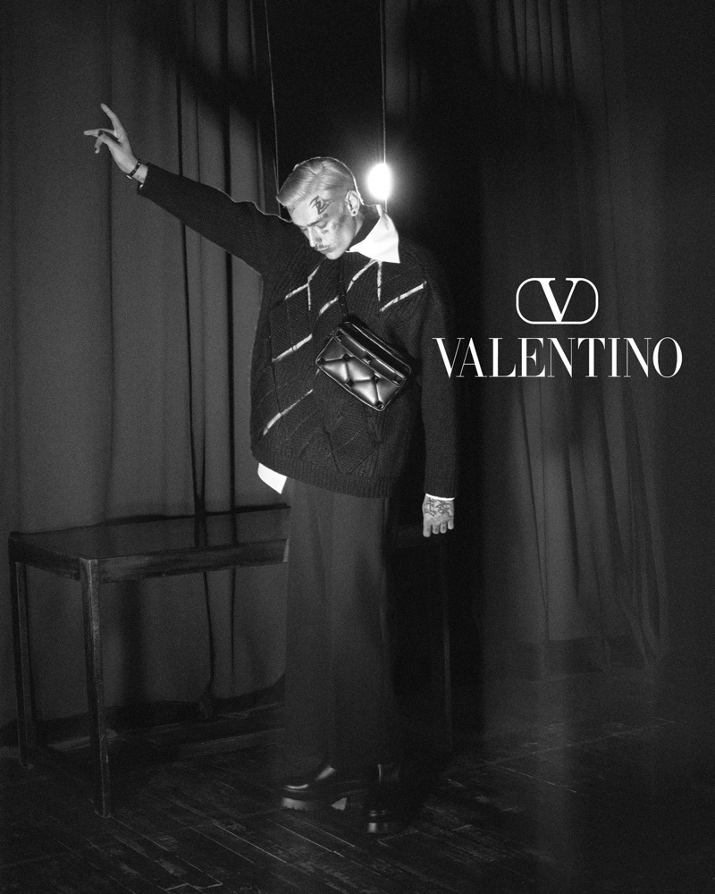 Model Teddy Corsica appears in a black and white image for Valentino's fall-winter 2021 men's campaign.