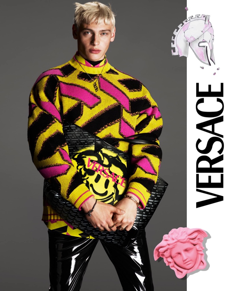 Lucas Barski rocks a graphic sweater for Versace's fall 2021 men's campaign.